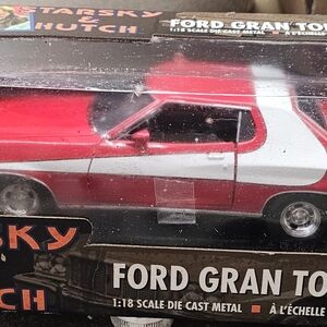 Red and White Ford Gran Torino Toy Car